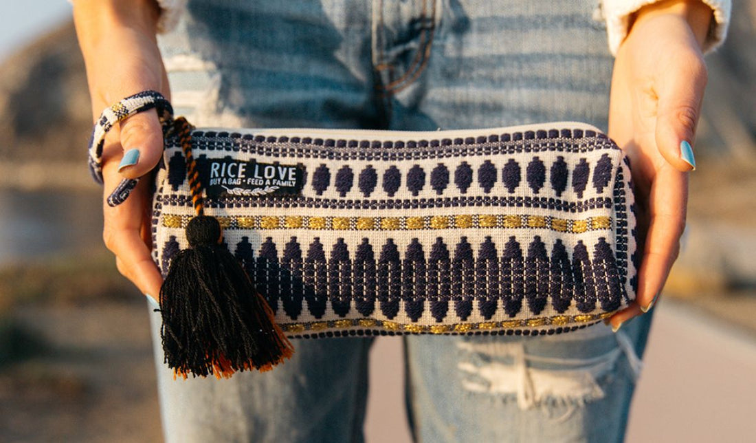 A person holding a stylish Rice Love pouch