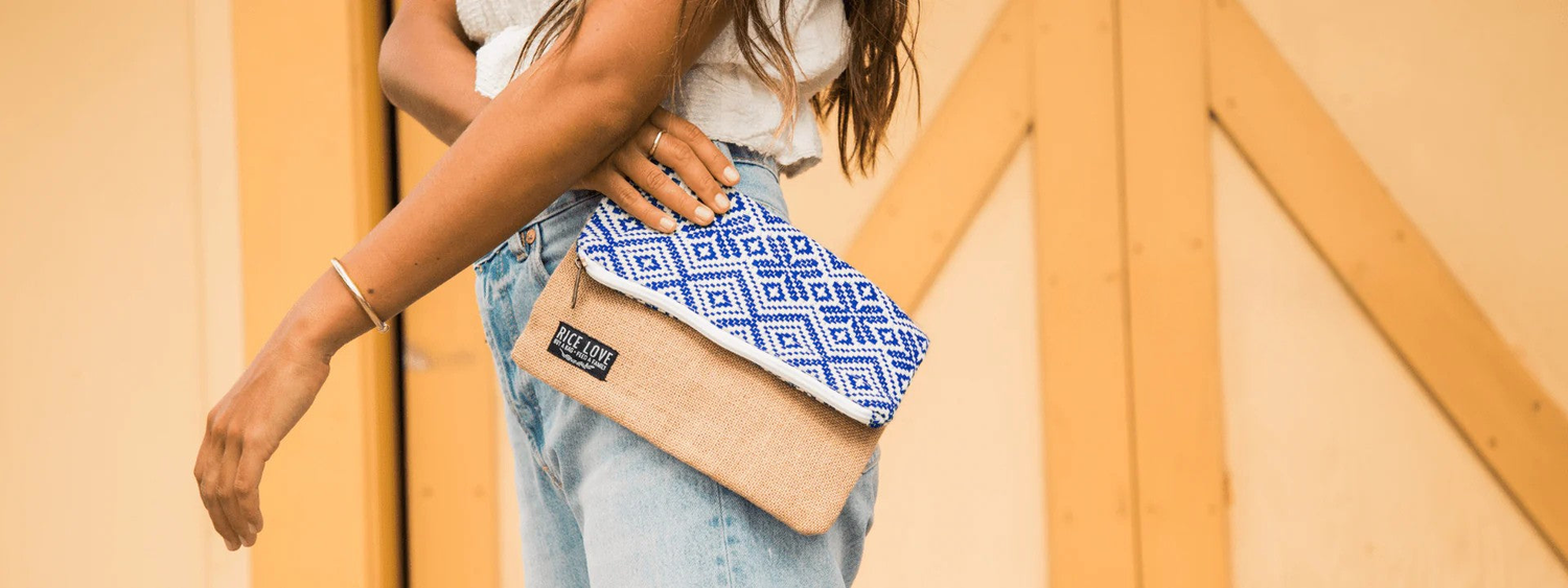 Woman holding a stylish clutch made from recycled burlap